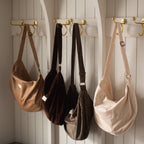 Croissant-shaped corduroy reusable bag with adjustable shoulder strap and zipper closure by Dans Le Sac