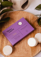 Soy wax melts in tulip scent by Mimi & August, showing colorful wax tarts in a clear container with a floral theme.