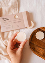Soy wax melts in Cielo scent by Mimi & August, displayed as colorful tart-shaped wax melts on a white surface.