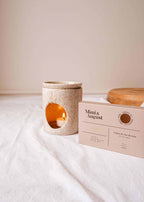 Soy wax melts in Cielo scent by Mimi & August, showcasing a set of elegant wax tarts with soft pastel packaging.