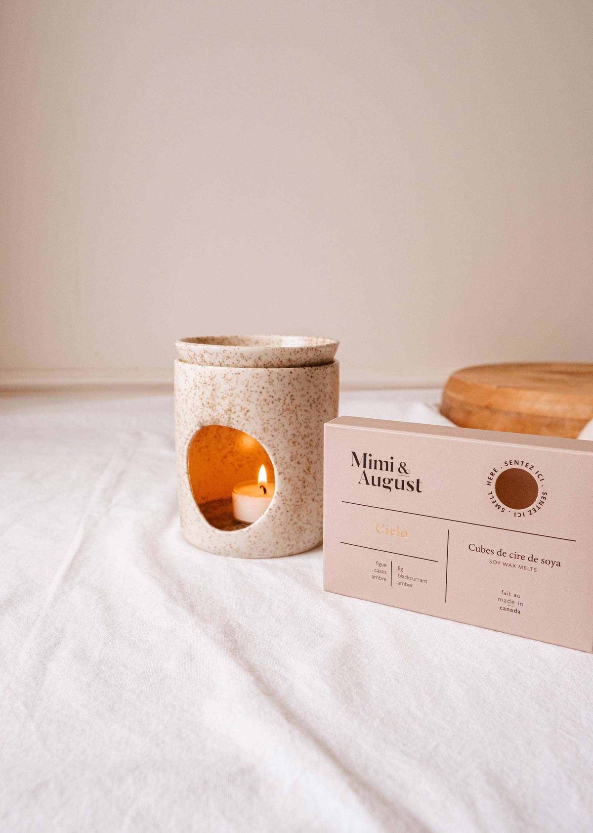 Soy wax melts in Cielo scent by Mimi & August, showcasing a set of elegant wax tarts with soft pastel packaging.