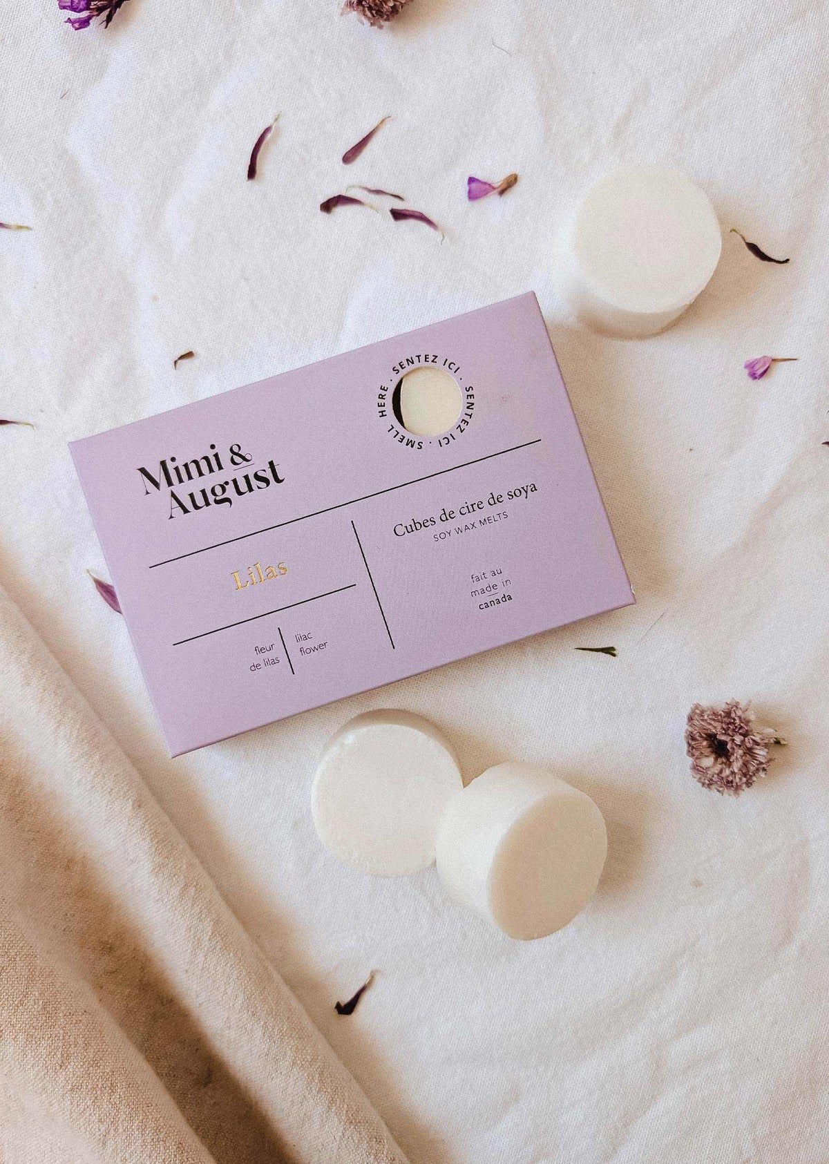 Soy wax melts in lilac color, shaped as wax tarts, from Mimi & August, suitable for home fragrance.