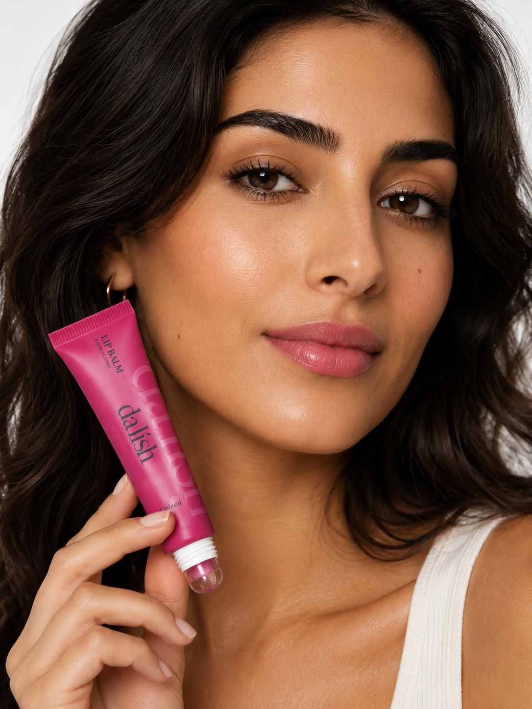 Hydrating tinted lip balm by da lish cosmetics displayed on model, showcasing soft, healthy lips with buildable color.
