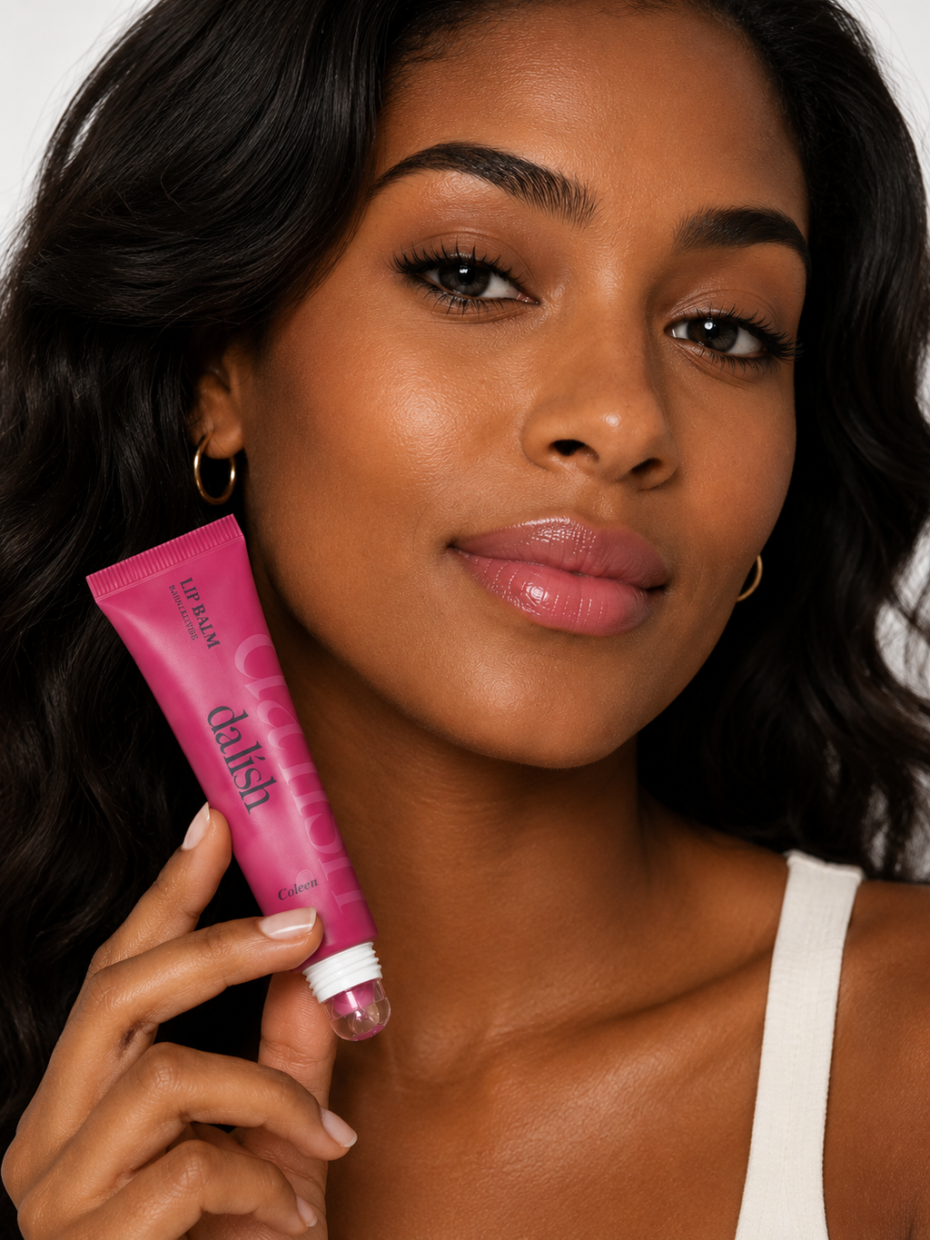 Da lish cosmetics hydrating tinted lip balm on model, showing soft, buildable color and healthy-looking lips.