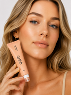 Hydrating tinted lip balm by da lish cosmetics in rose shade, softening lips with buildable, natural color.