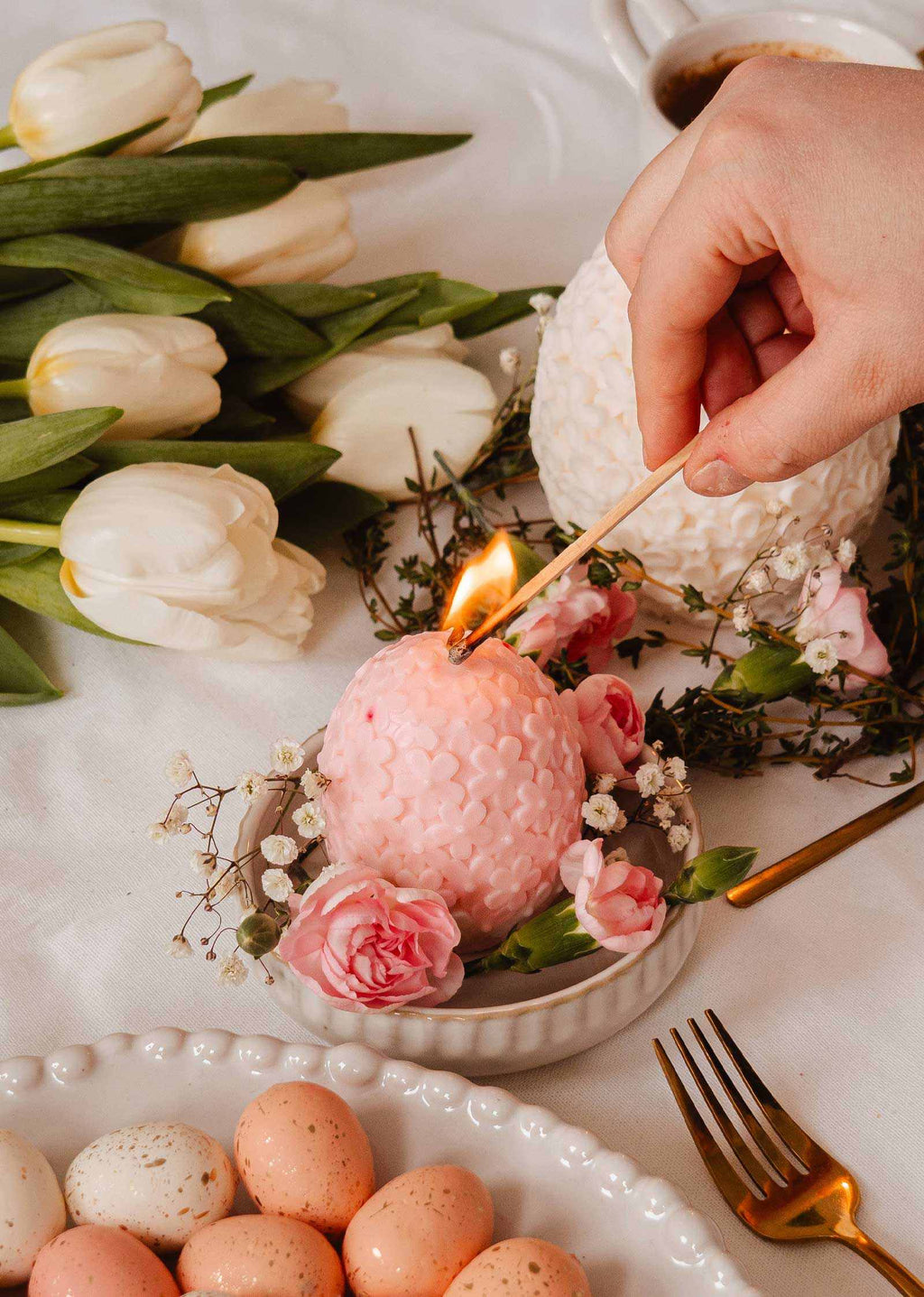 Decorative floral egg candle by Mimi & August featuring a delicate floral design and warm candlelight.