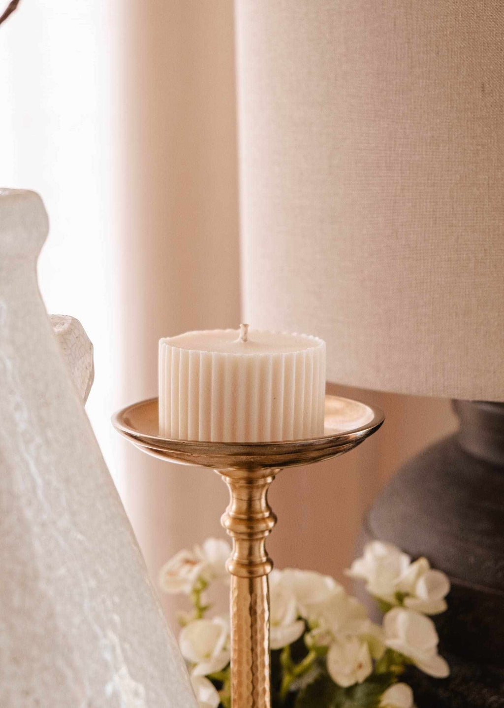 Topaze candle refill by Mimi & August, 5 oz glass container with a warm amber-colored wax for home decor.