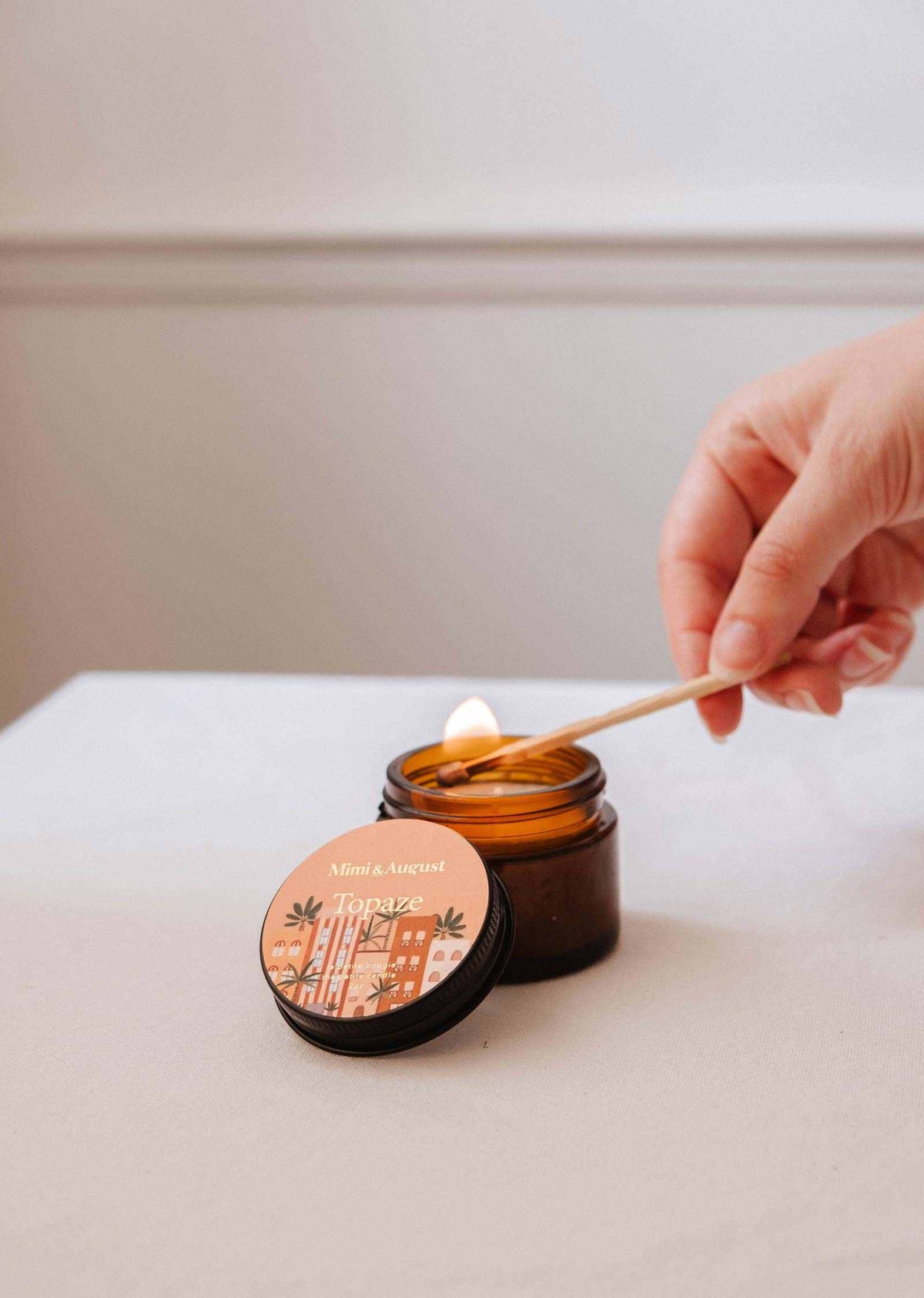 Mini Topaze soy candle by Mimi & August in a 2 oz glass container with a natural wax finish.