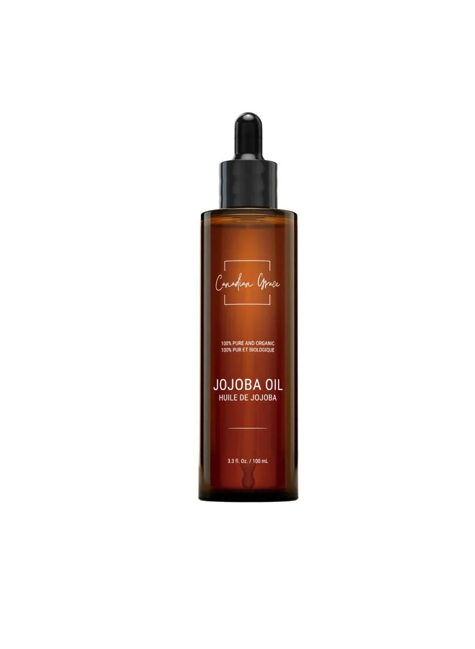 Canadian Grace Wellness 100% organic jojoba oil in a glass bottle, suitable for sensitive skin and oily or dry scalps.