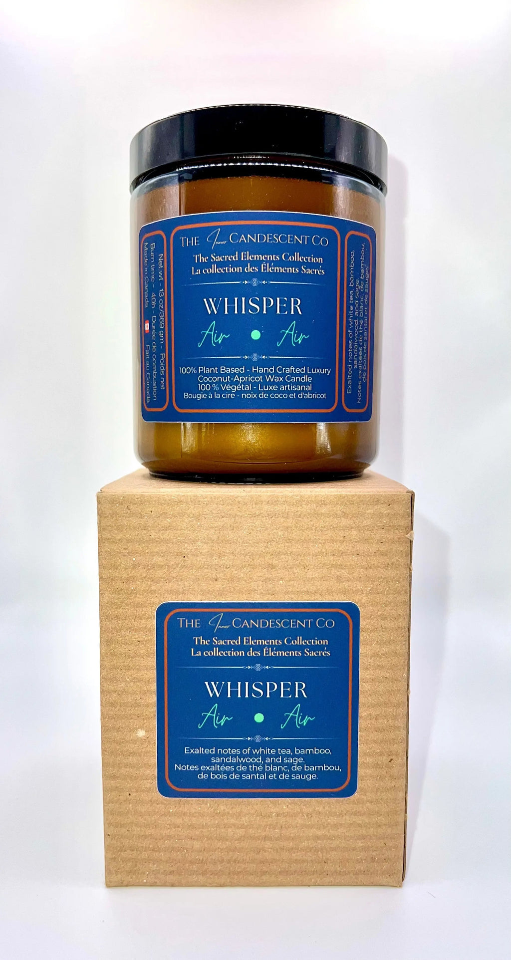The InnerCandescent Co Whisper Air Element candle in a tall tower shape with fresh coconut and apricot wax, emitting a soft glow.