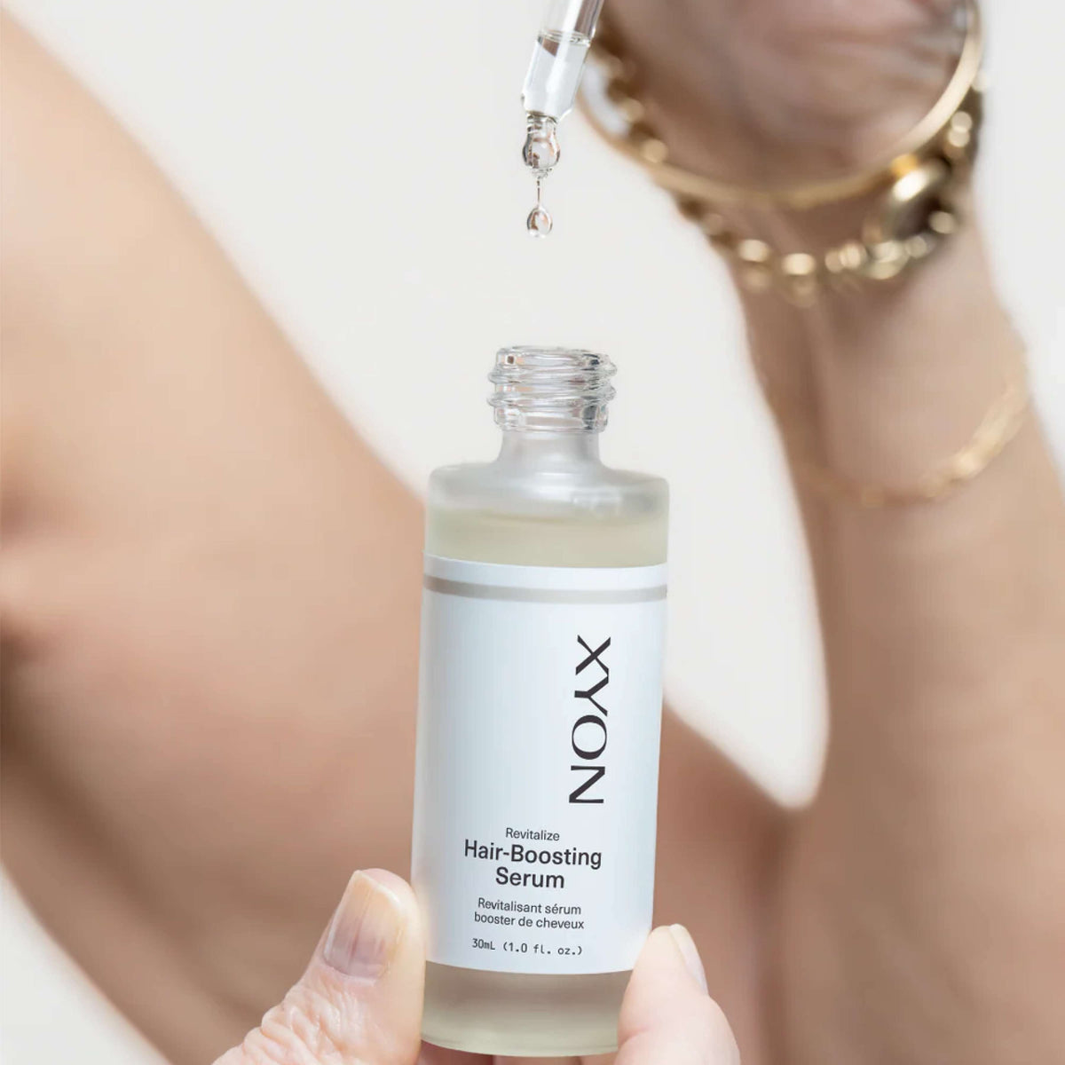 Wedoskin XYON Revitalize Hair-Boosting Serum for women, featuring a sleek bottle with dropper, designed to strengthen and rejuvenate hair.