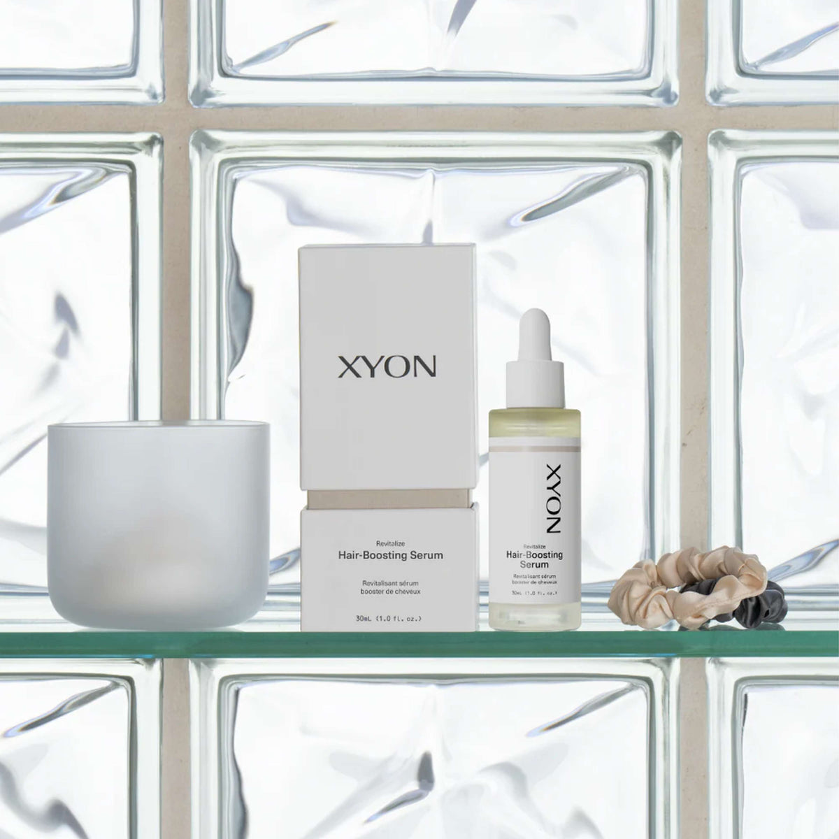 XYON Revitalize Hair-Boosting Serum for Women by wedoskin, featuring a sleek bottle and dropper for hair repair treatment.