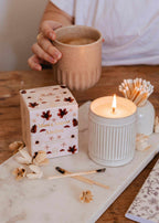 Amber reusable soy candle by Mimi & August in a clear glass jar, perfect for home decor and ambiance.