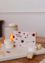 Soy wax melts in Ambre scent from Mimi & August, showcasing a set of fragrant wax tarts in warm amber hues.
