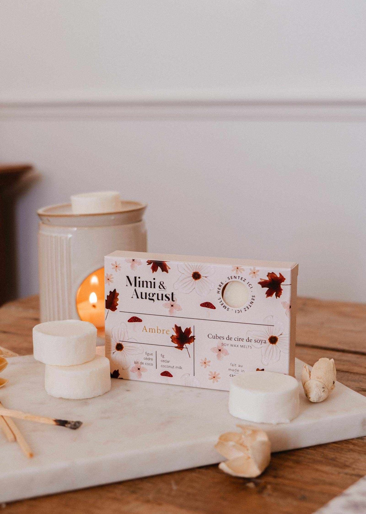 Soy wax melts in Ambre scent from Mimi & August, showcasing a set of fragrant wax tarts in warm amber hues.