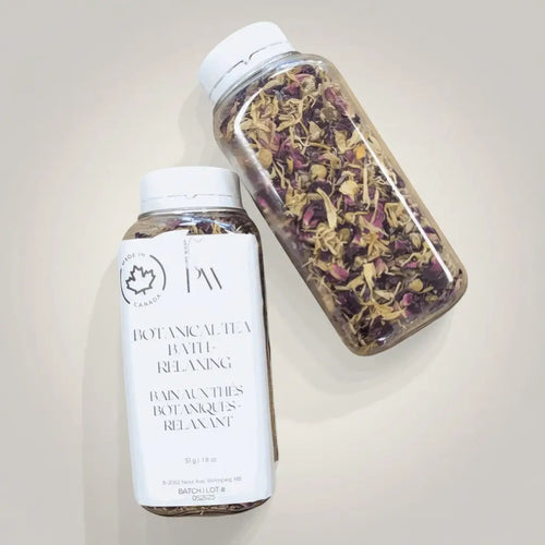 Pure Wash Botanical Tea Bath additive in a clear plastic bottle with a white cap, showcasing herbal tea ingredients for relaxing baths.