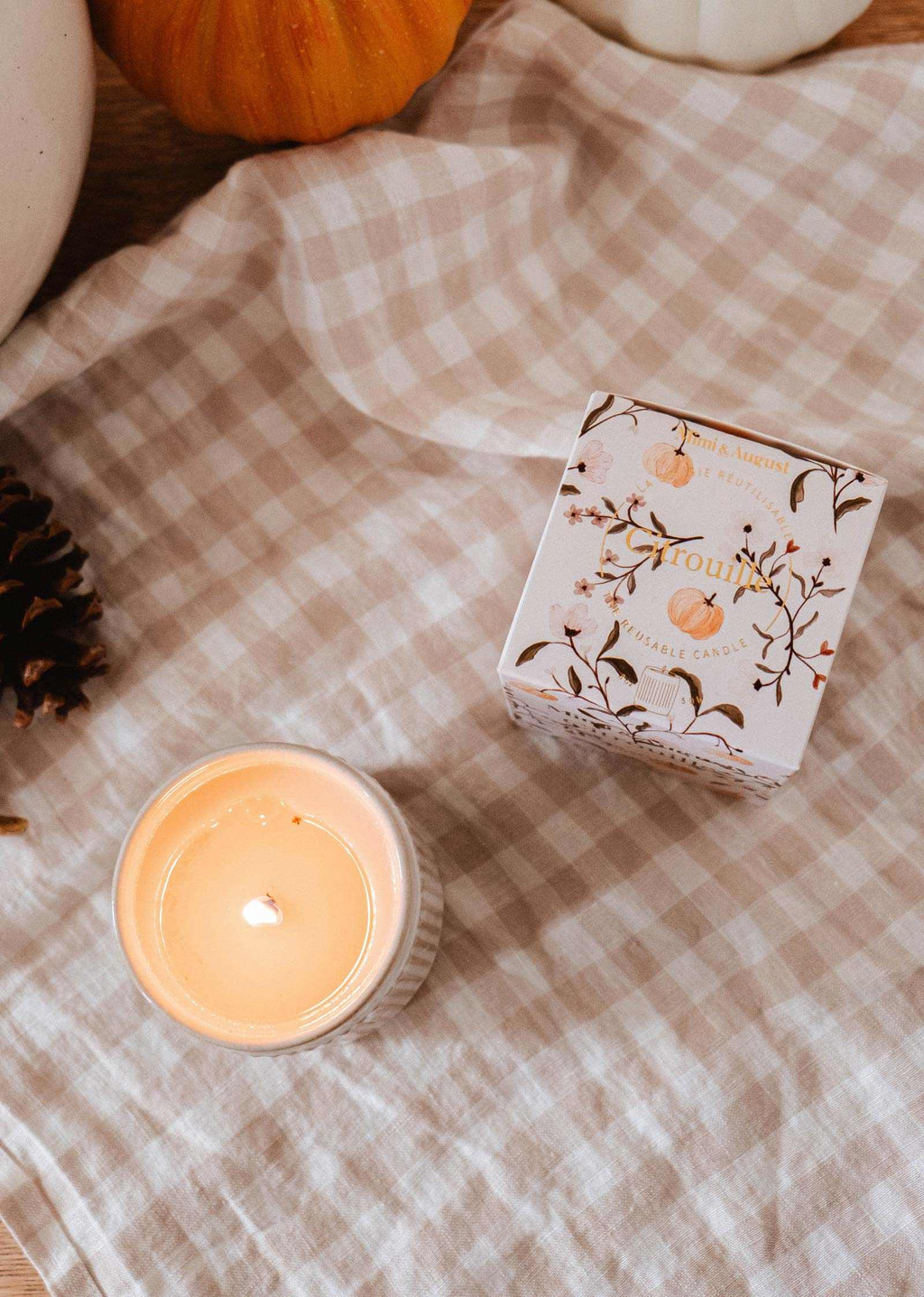 Mimi & August Citrouille reusable soy candle in a pumpkin-shaped container, perfect for cozy home decor.
