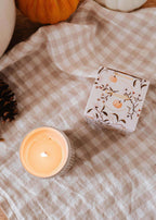 Mimi & August Citrouille reusable soy candle in a pumpkin-shaped container, perfect for cozy home decor.