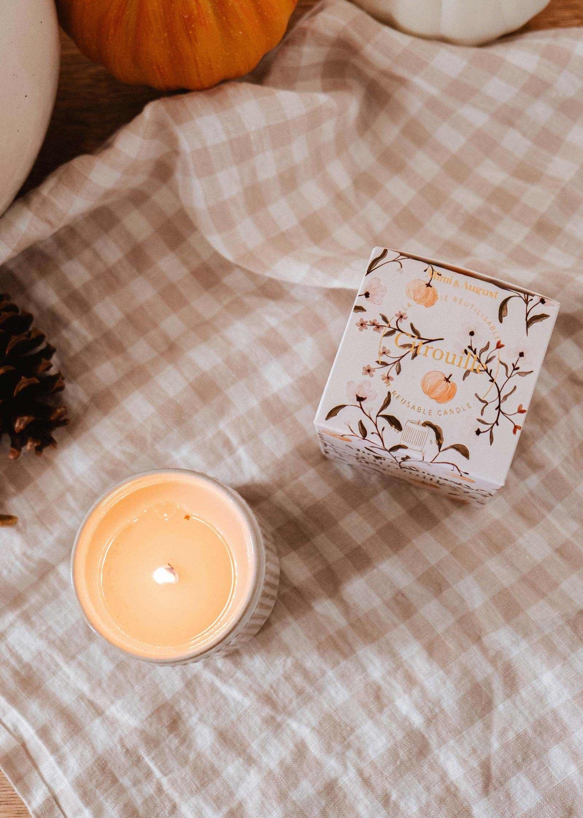 Mimi & August Citrouille reusable soy candle in a pumpkin-shaped container, perfect for cozy home decor.
