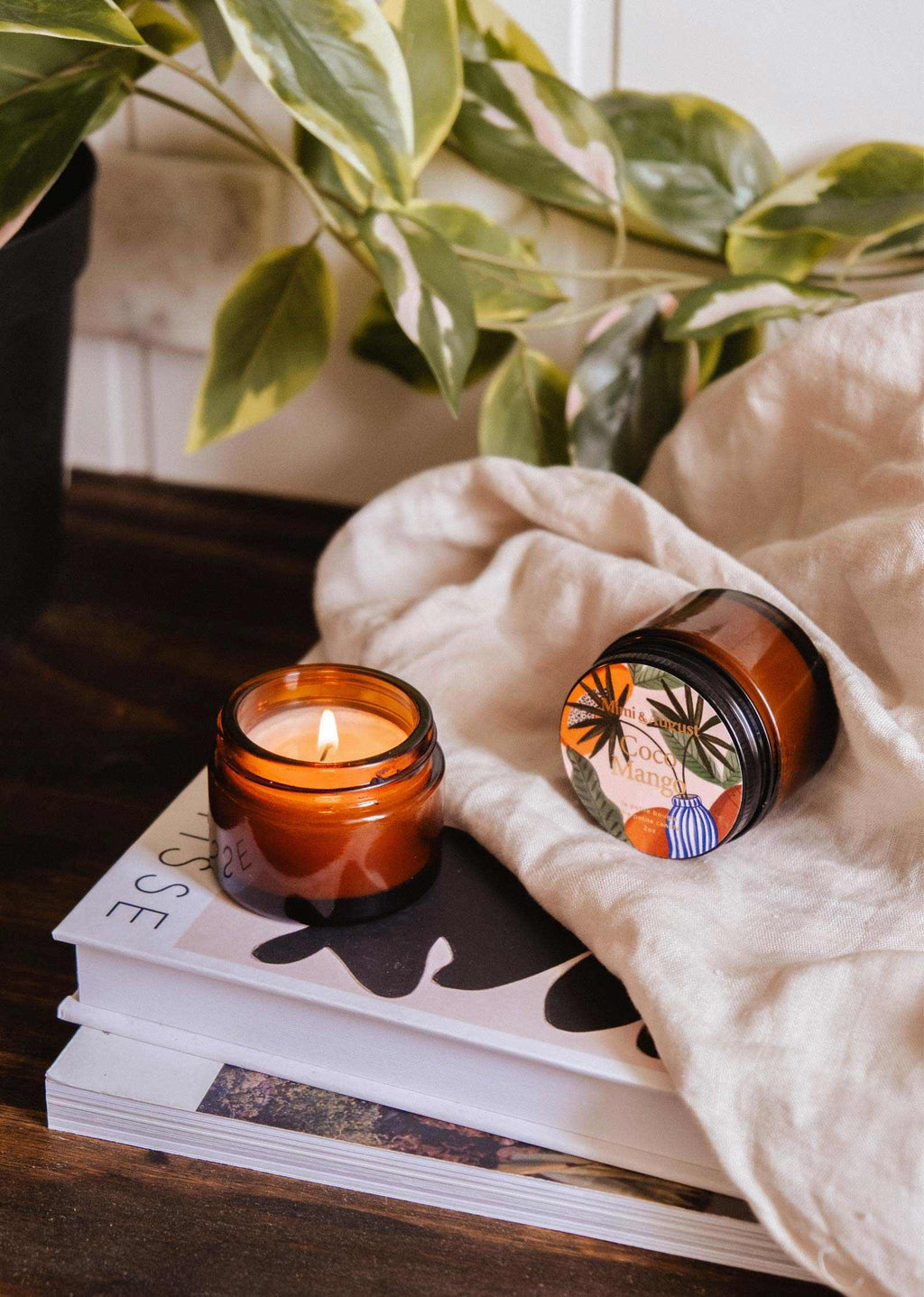 Mini Coco Mango soy candle by Mimi & August in a 2 oz container, featuring a bright mango and coconut fragrance.