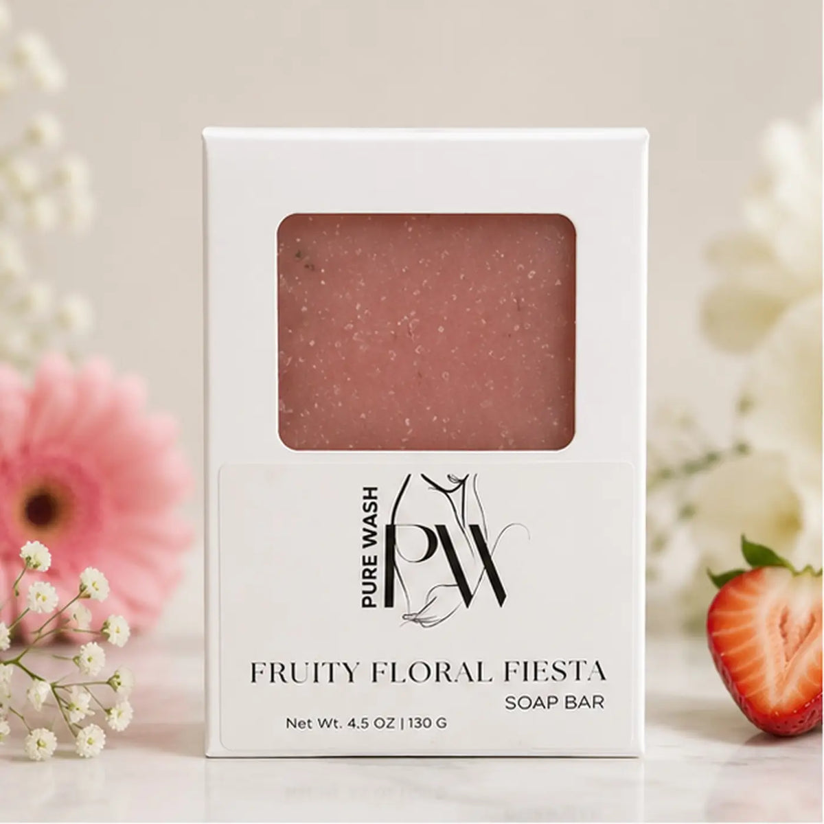 Handmade Fruity Floral Fiesta soap bar by Pure Wash with pink speckles and floral design on a white background.
