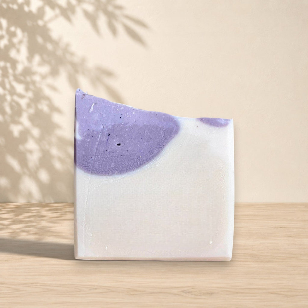 Handmade La Sultana Brazilian clay milk soap bar with natural ingredients, showcasing a soft, creamy texture and earthy tones.