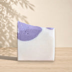 Handmade La Sultana Brazilian clay milk soap bar with natural ingredients, showcasing a soft, creamy texture and earthy tones.