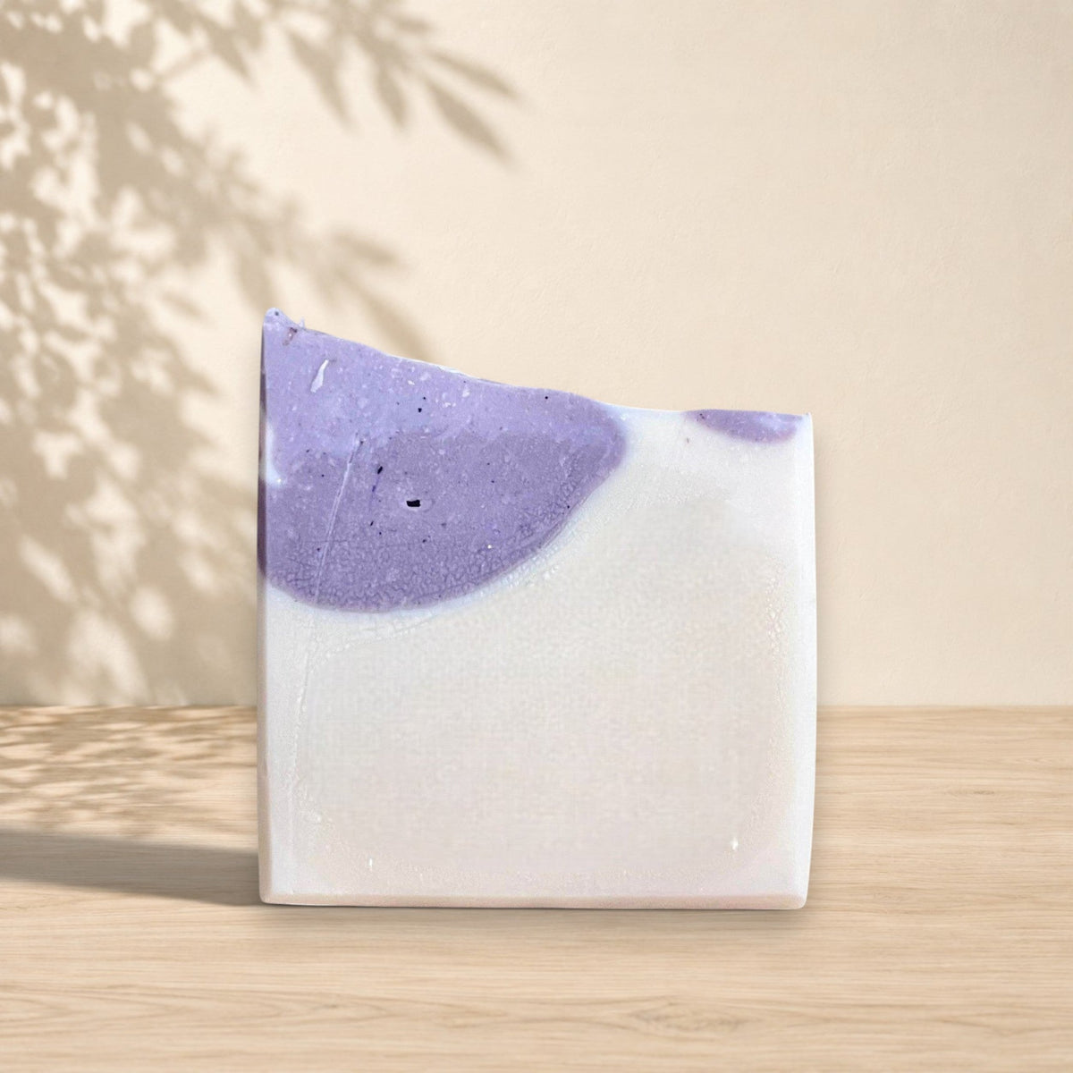 Handmade La Sultana Brazilian clay milk soap bar with natural ingredients, showcasing a soft, creamy texture and earthy tones.