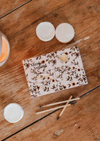 Heirloom soy wax melts in a decorative tart shape by Mimi & August, ideal for adding fragrance to your home.