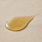 Canadian Grace Wellness 100% organic jojoba oil bottle, ideal for sensitive, acne-prone skin and dry or oily scalp.