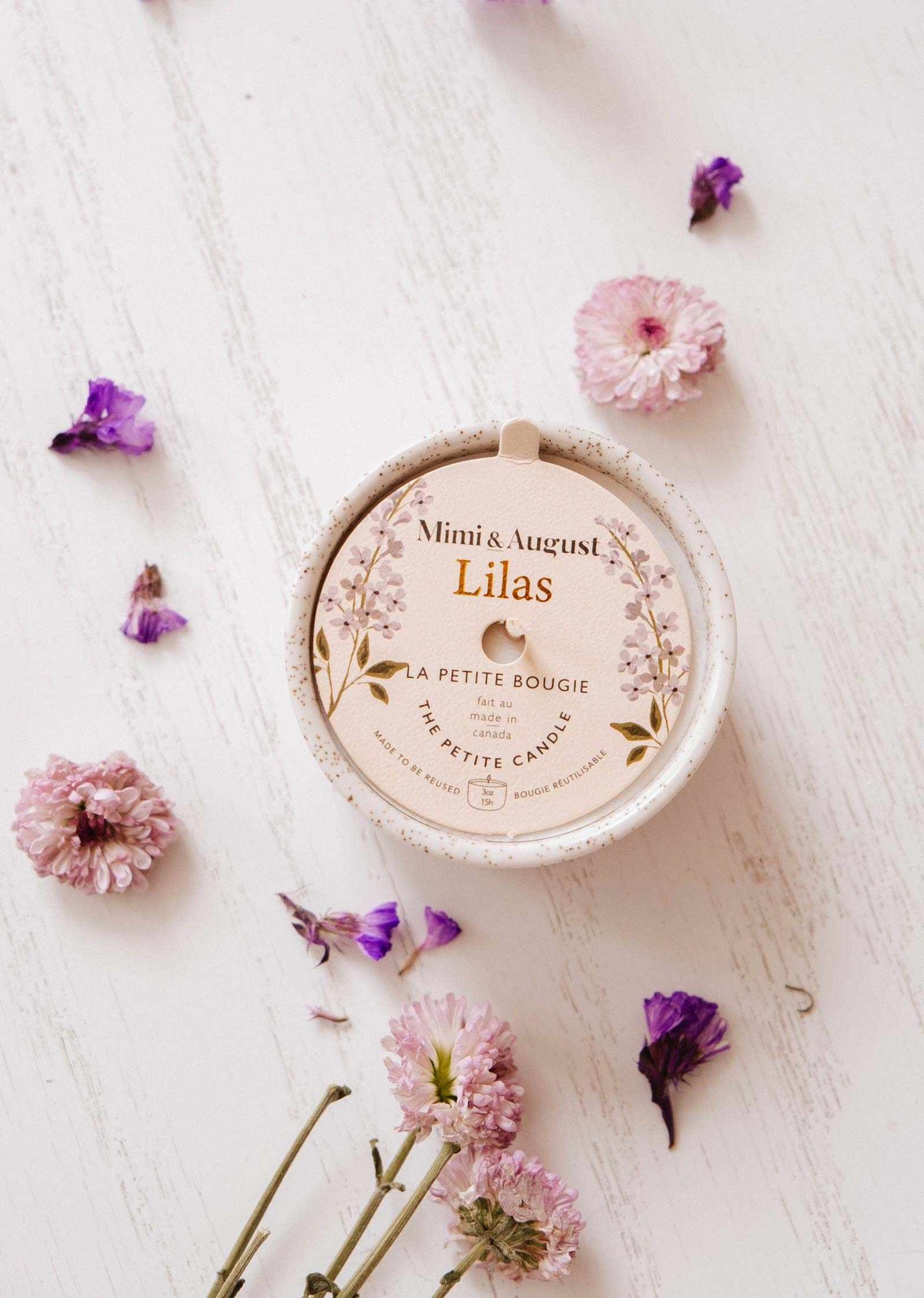 Lilac reusable candle in a 3 oz container by Mimi & August, perfect for home decor and adding a touch of color.