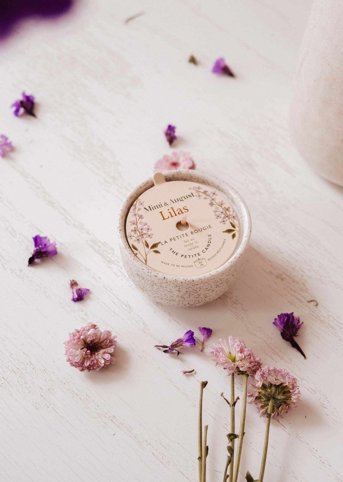 Lilac reusable candle from Mimi & August, 3 oz home decor candle with a sleek design and soft purple color.