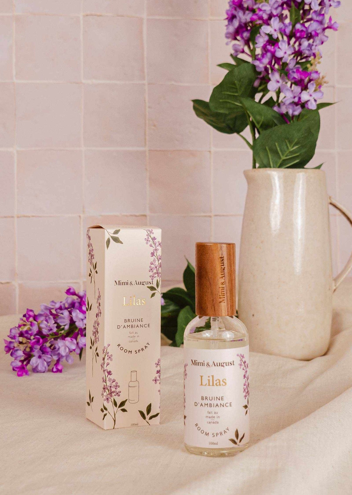 Mimi & August Lilas room spray in a 100ml brown ambiance bottle with a lavender-lilac label and cap.