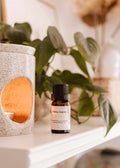 Mimi & August lilac scented oil in a small glass bottle, showcasing the floral fragrance and elegant packaging.