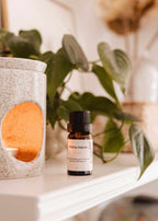 Mimi & August lilac scented oil in a small glass bottle, showcasing the floral fragrance and elegant packaging.