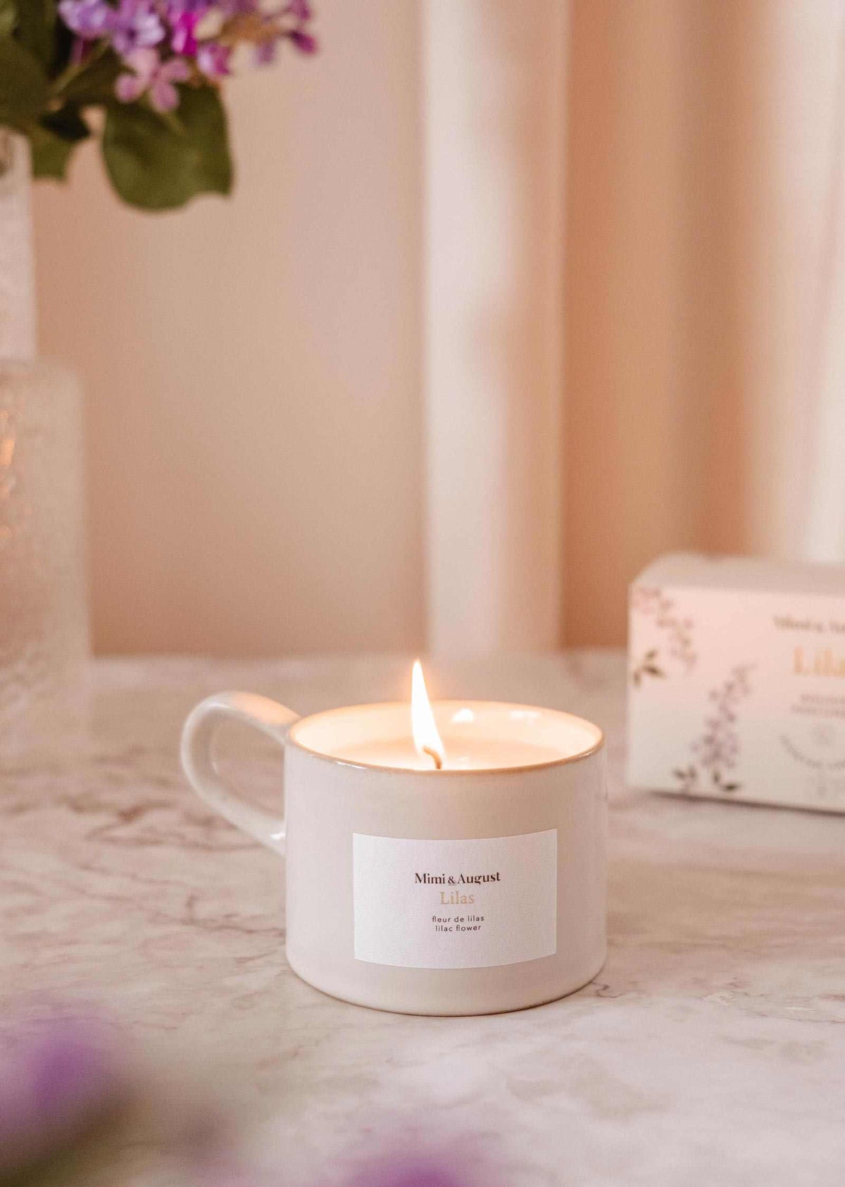 Lilac reusable soy candle from Mimi & August, decorative home decor with a soft lilac-colored glass container.