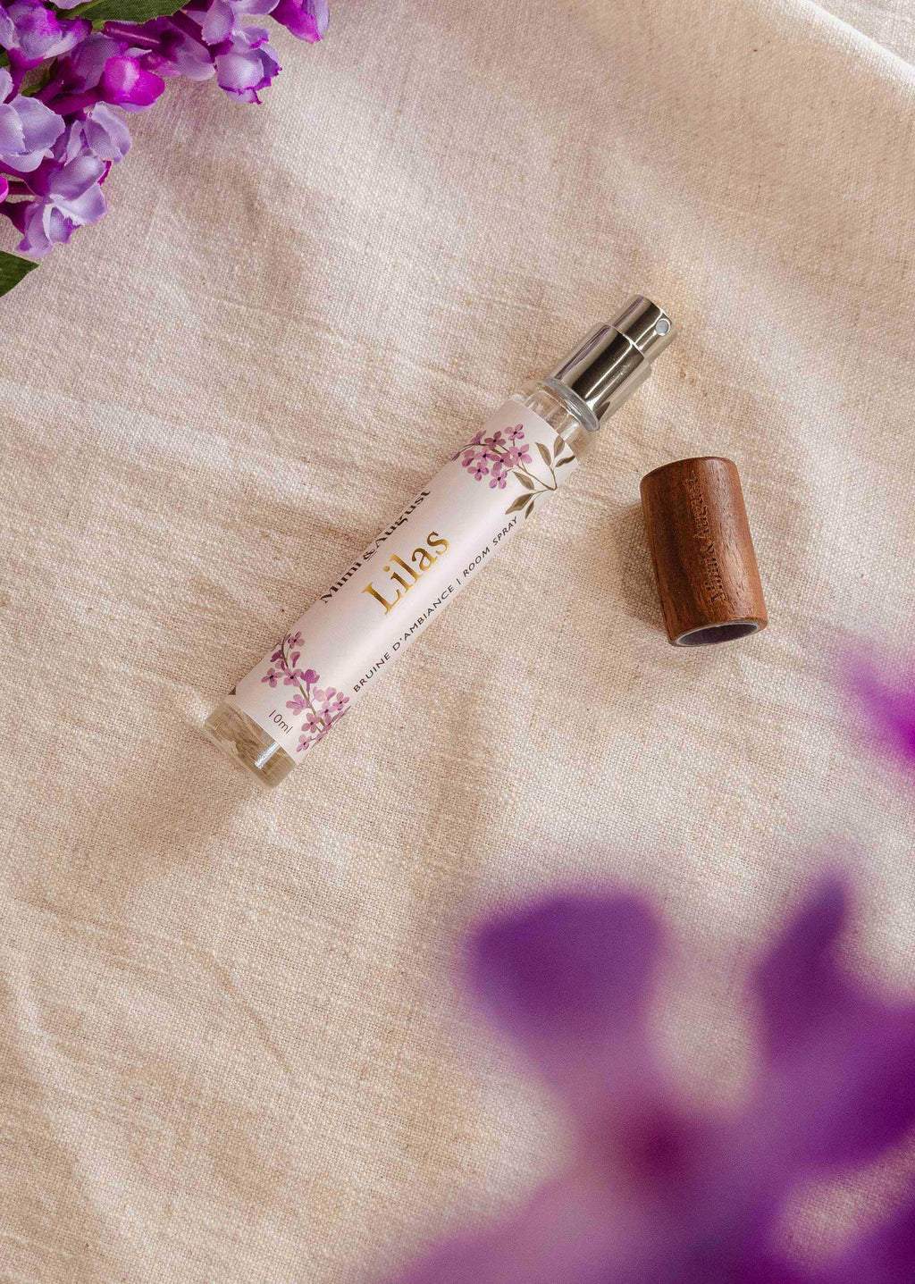 Mimi & August Lilas 10ml ambiance room spray bottle with purple floral design, ideal for freshening indoor spaces.