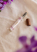 Mimi & August Lilas 10ml ambiance room spray bottle with purple floral design, ideal for freshening indoor spaces.