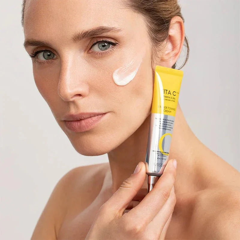 MISSHA Vita C Plus Eraser Toning Cream in 30ml jar, a brightening skincare cream by Lakinza K-beauty, with vibrant orange packaging.