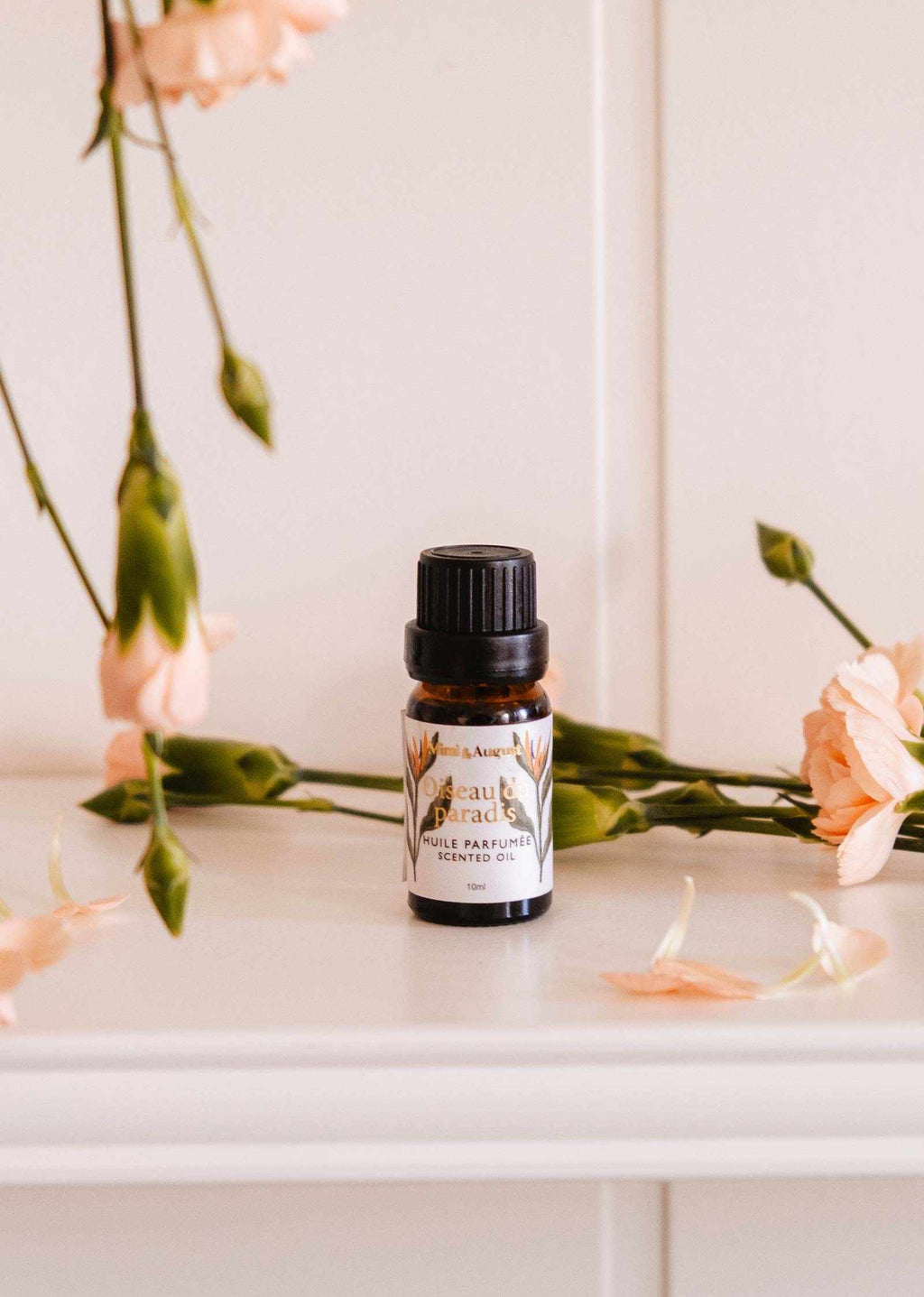 Mimi & August Oiseau du Paradis scented oil bottle with elegant label and floral design, showcasing the scented oil product.