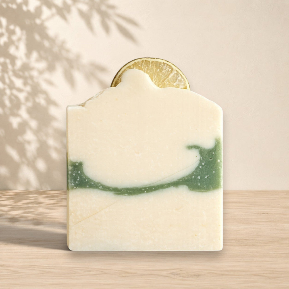 Natural coconut milk soap with lime and eucalyptus scent by La Sultana Savonnerie, featuring fresh lime and eucalyptus leaves.