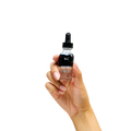 Peach and Cream ® after shave bottle for shaving aftercare, with a sleek design and label featuring the brand logo.