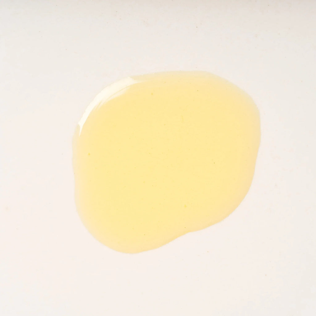 Peach and Cream® shaving primer base with smooth oil texture, designed to prepare skin for a close, comfortable shave.