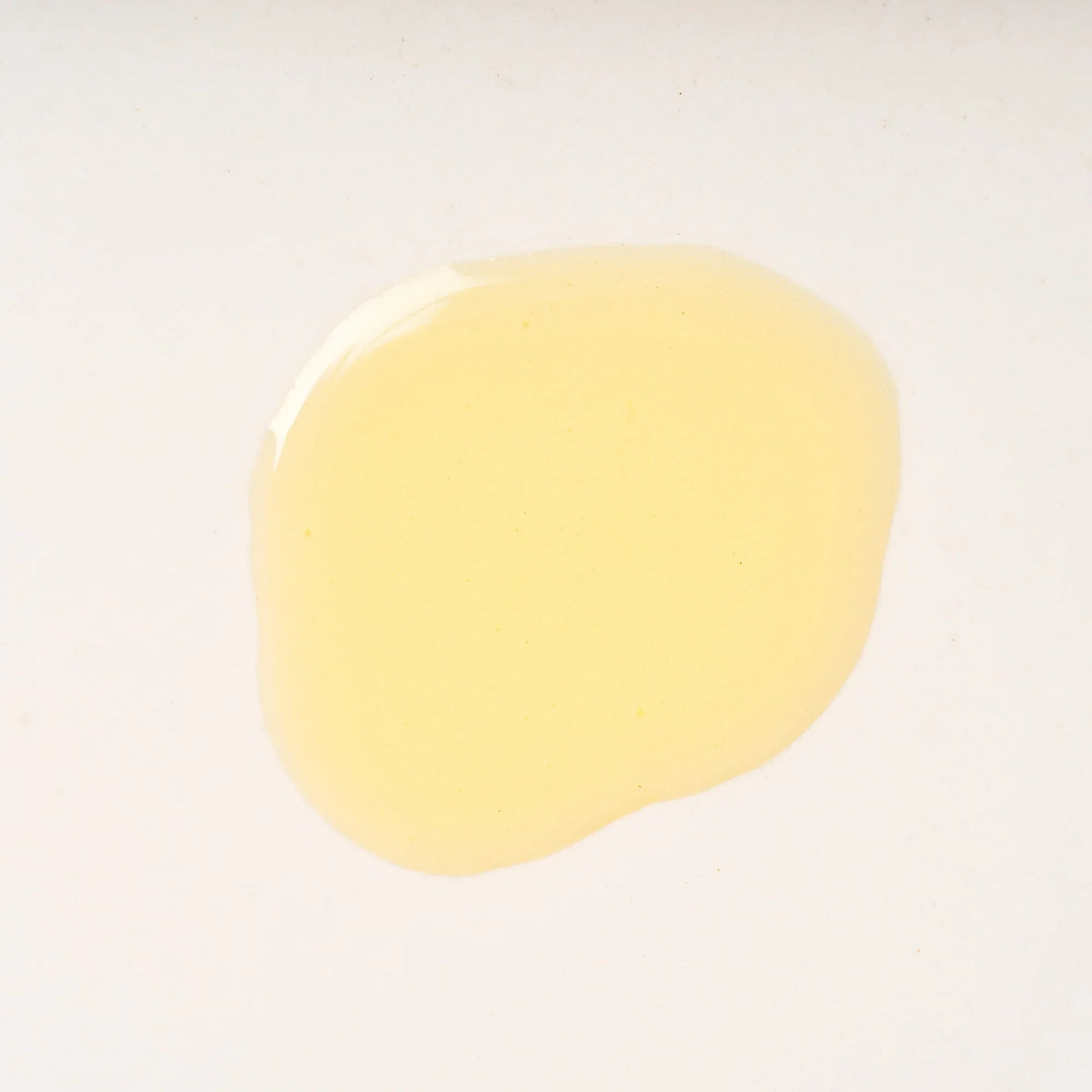 Peach and Cream® shaving primer base with smooth oil texture, designed to prepare skin for a close, comfortable shave.