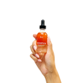 Peach and Cream® restorative body oil bath oil with a clear glass bottle and golden oil, ideal for nourishing skin during bath time.