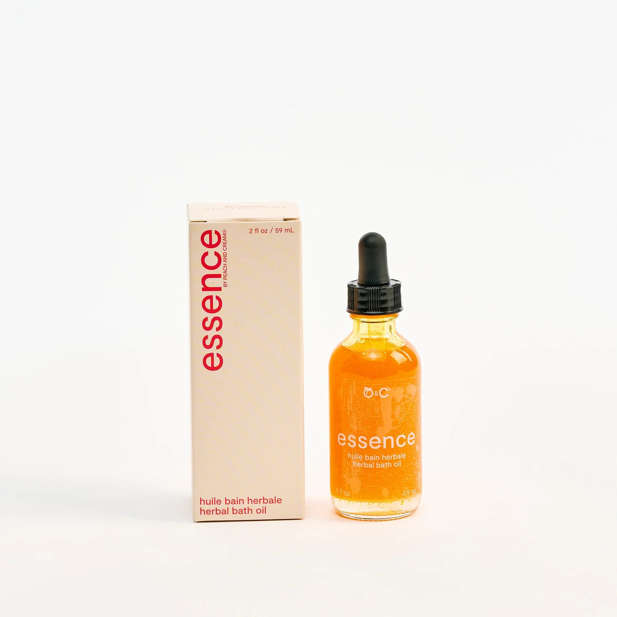 Peach and Cream restorative body oil bath oil bottle in elegant packaging with peach and cream branding.