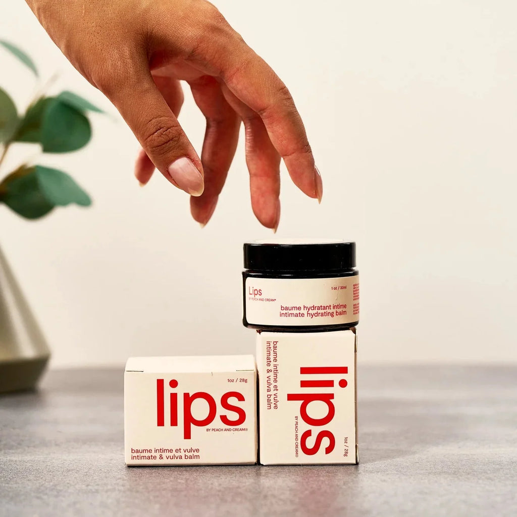 Peach and Cream vulva balm for lips, in a sleek container, with a natural and nourishing appearance, suitable for sensitive skin.