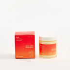 Peach and Cream® massage candle melt with a soft glow and warm wax, perfect for relaxing massage therapy sessions.