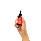 Peach and Cream arousal tonic serum in a sleek bottle, showing the clear gel formula and elegant packaging.