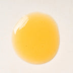 Peach and Cream arousal tonic serum with gel texture, featuring a sleek bottle and applicator for intimate wellness.
